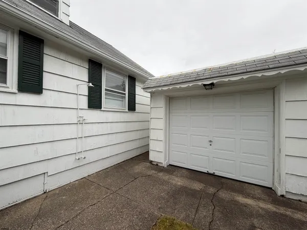 a view of backyard with garage