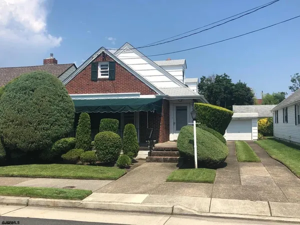 a view of a house with a sink and a yard