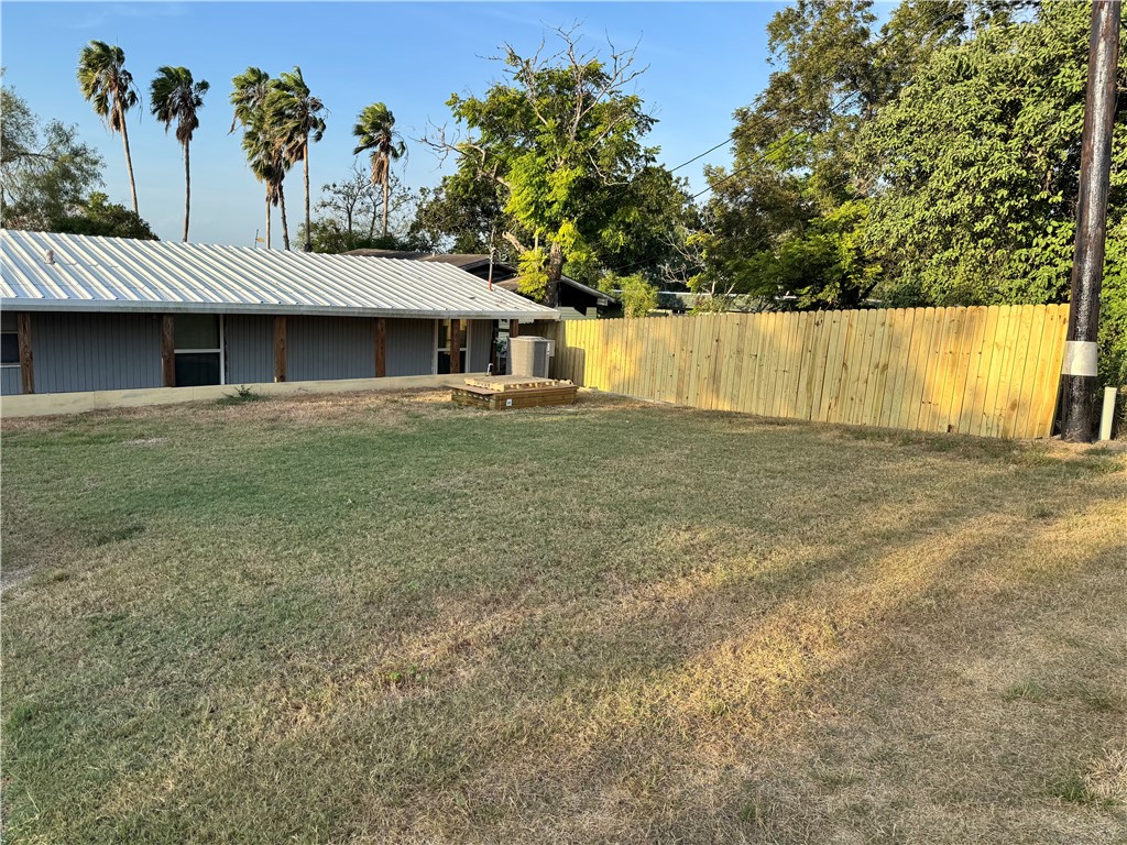 307 Stephens Loop Mathis, TX 78368 - Photo 2 of 38 FRONT YARD SPORTS A NEW WOODEN FENCE!