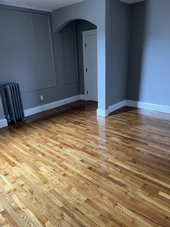 840 Massachusetts Avenue, Unit 8 Arlington, MA 02476 - Photo 4 of 8 a view of a room with wooden floor