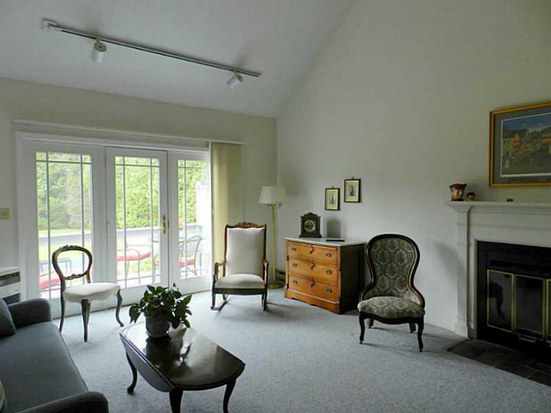 5 Wonderbrook Drive, Unit 5 Kennebunk, ME 04043 - Photo 11 of 25 Living Room. Back Doors to Deck