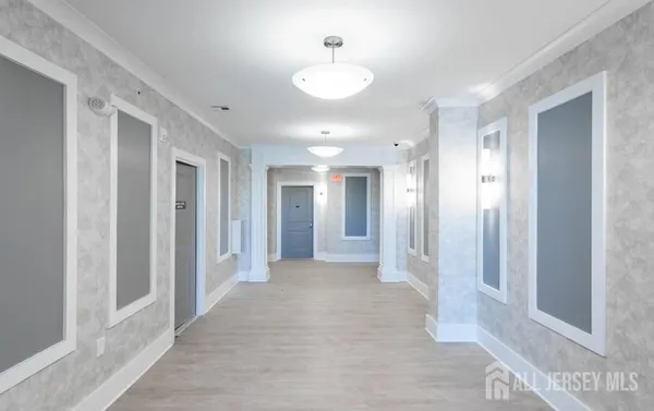 a view of a hallway with wooden shelves