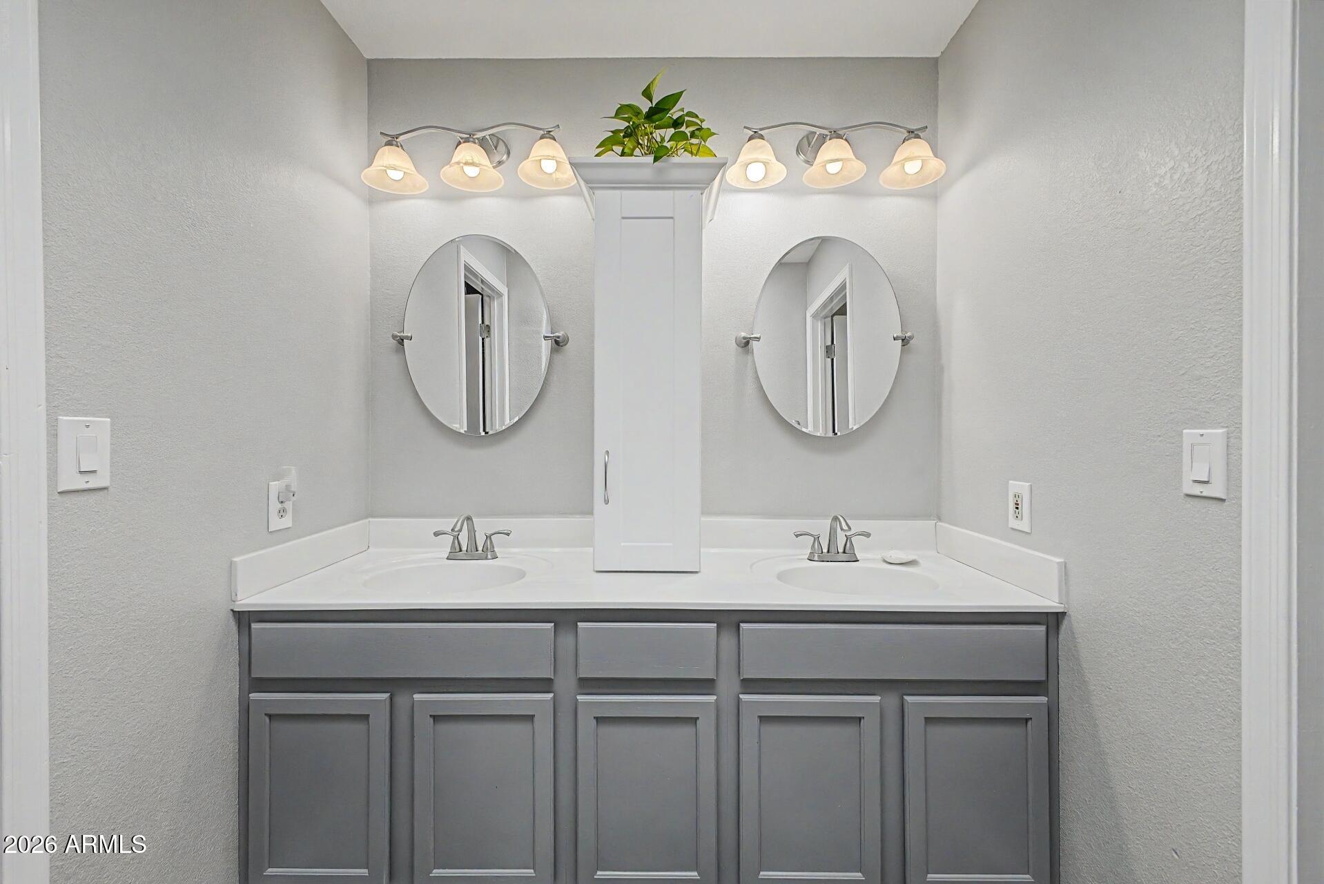 6335 East Brown Road, Unit 1144 Mesa, AZ 85205 - Photo 16 of 28 a bathroom with a sink and a mirror