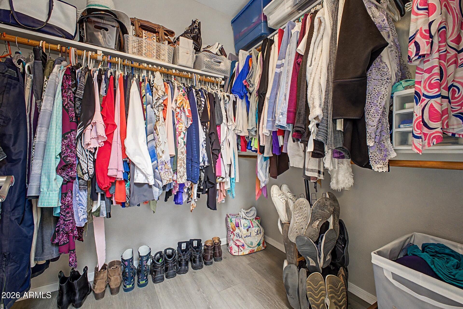 6335 East Brown Road, Unit 1144 Mesa, AZ 85205 - Photo 18 of 28 a view of walk in closet with clothes