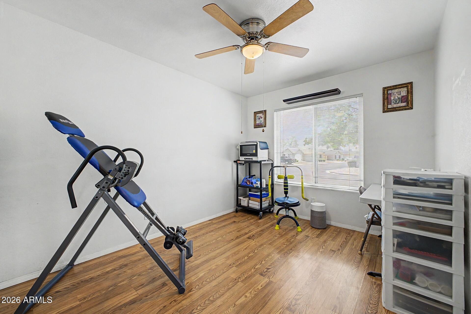 6335 East Brown Road, Unit 1144 Mesa, AZ 85205 - Photo 19 of 28 a view of a workspace with furniture and a window