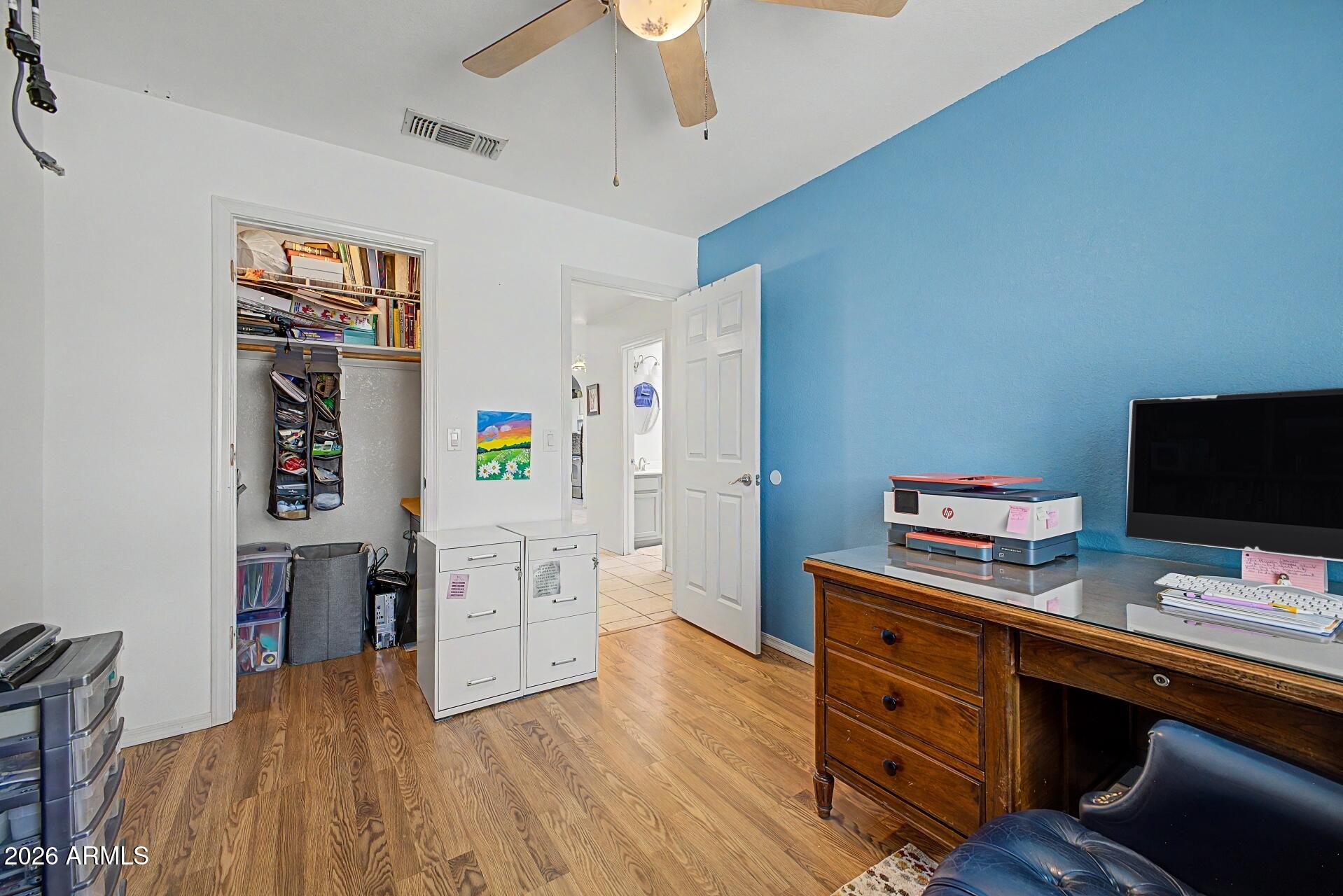 6335 East Brown Road, Unit 1144 Mesa, AZ 85205 - Photo 23 of 28 a view of a workspace with furniture and wooden floor
