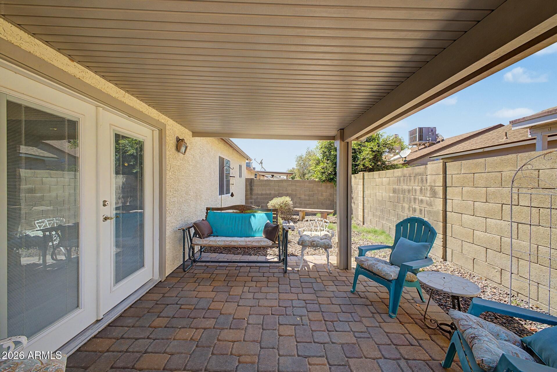 6335 East Brown Road, Unit 1144 Mesa, AZ 85205 - Photo 25 of 28 a outdoor space with lots of chairs and a potted plant