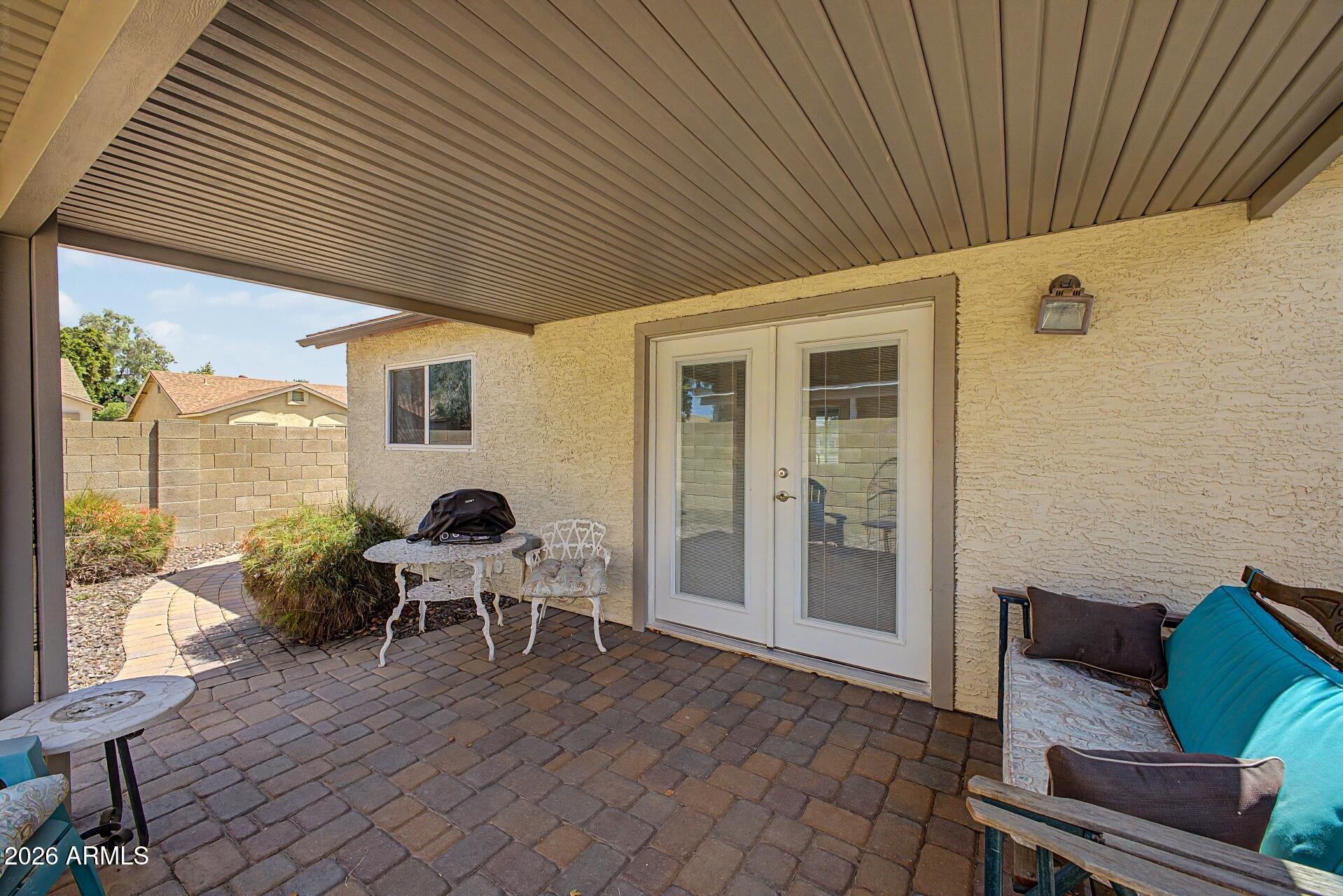 6335 East Brown Road, Unit 1144 Mesa, AZ 85205 - Photo 26 of 28 a dining room with furniture and wooden floor