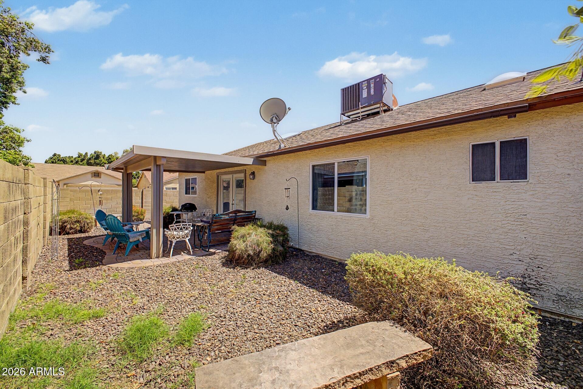 6335 East Brown Road, Unit 1144 Mesa, AZ 85205 - Photo 27 of 28 a front view of house with yard outdoor seating and barbeque oven