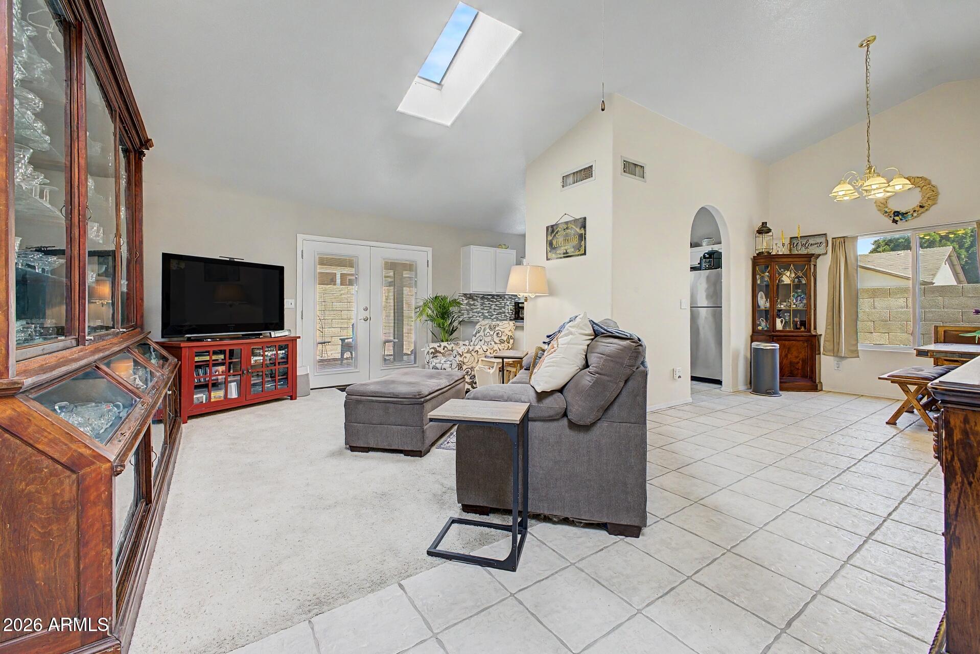 6335 East Brown Road, Unit 1144 Mesa, AZ 85205 - Photo 4 of 28 a living room with furniture and a flat screen tv