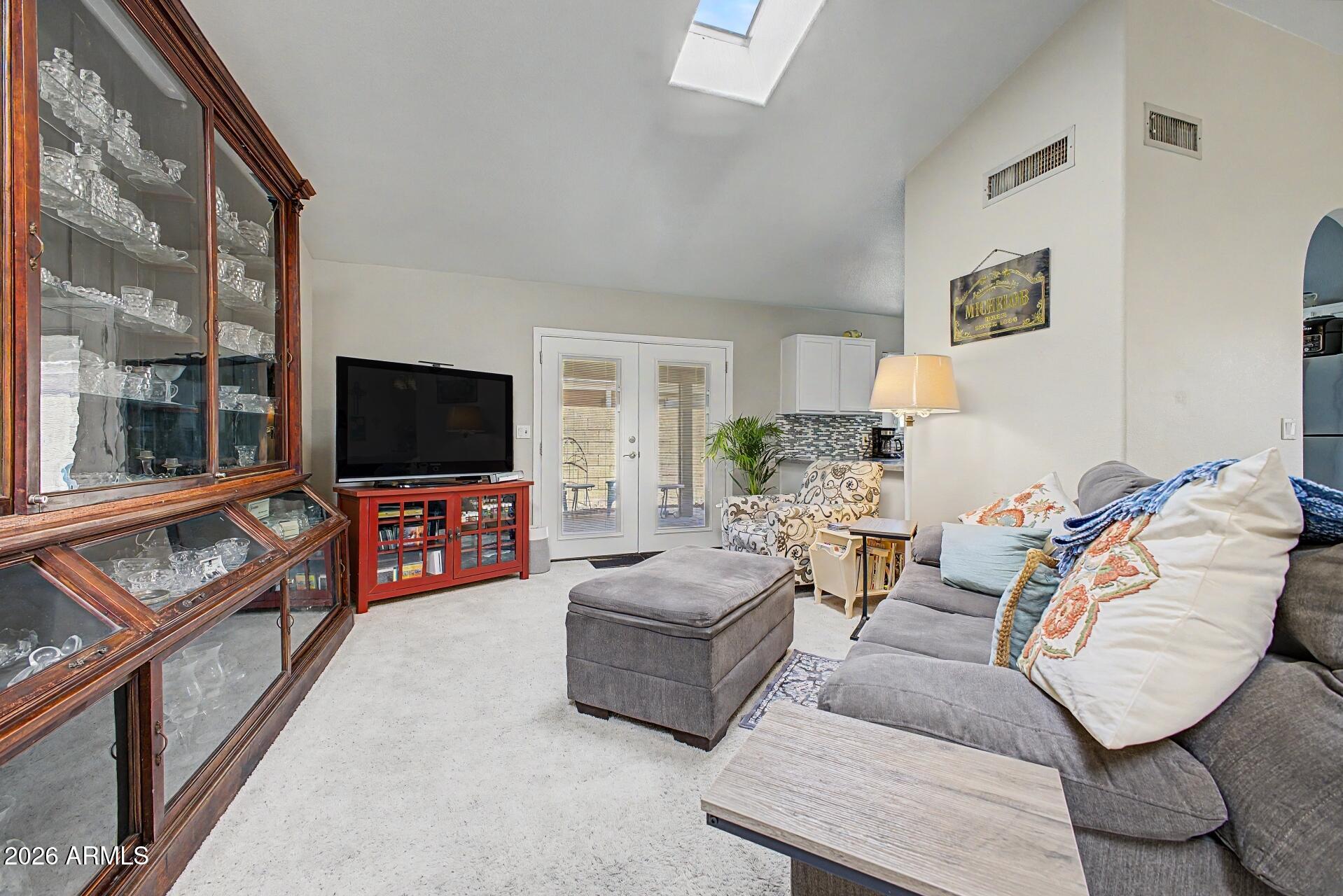 6335 East Brown Road, Unit 1144 Mesa, AZ 85205 - Photo 6 of 28 a living room with furniture and a flat screen tv
