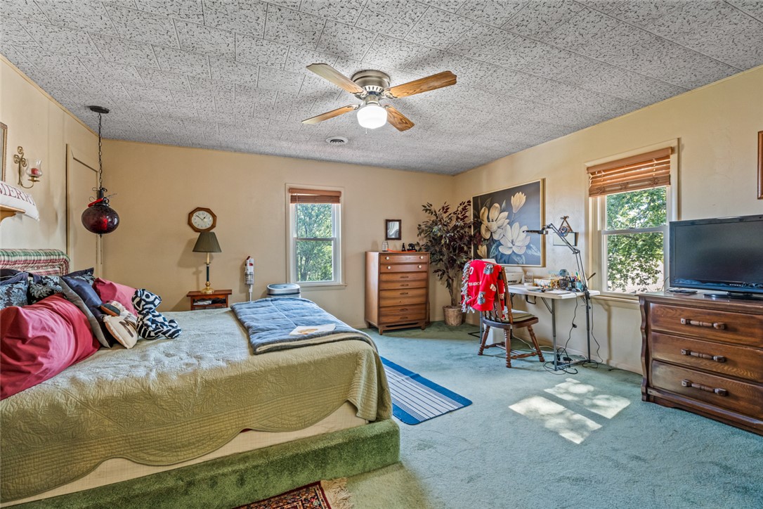 7404 Grubbs-Rex Road Arcanum, OH 45304 - Photo 21 of 40 This spacious room provides a comfortable and versatile living area.