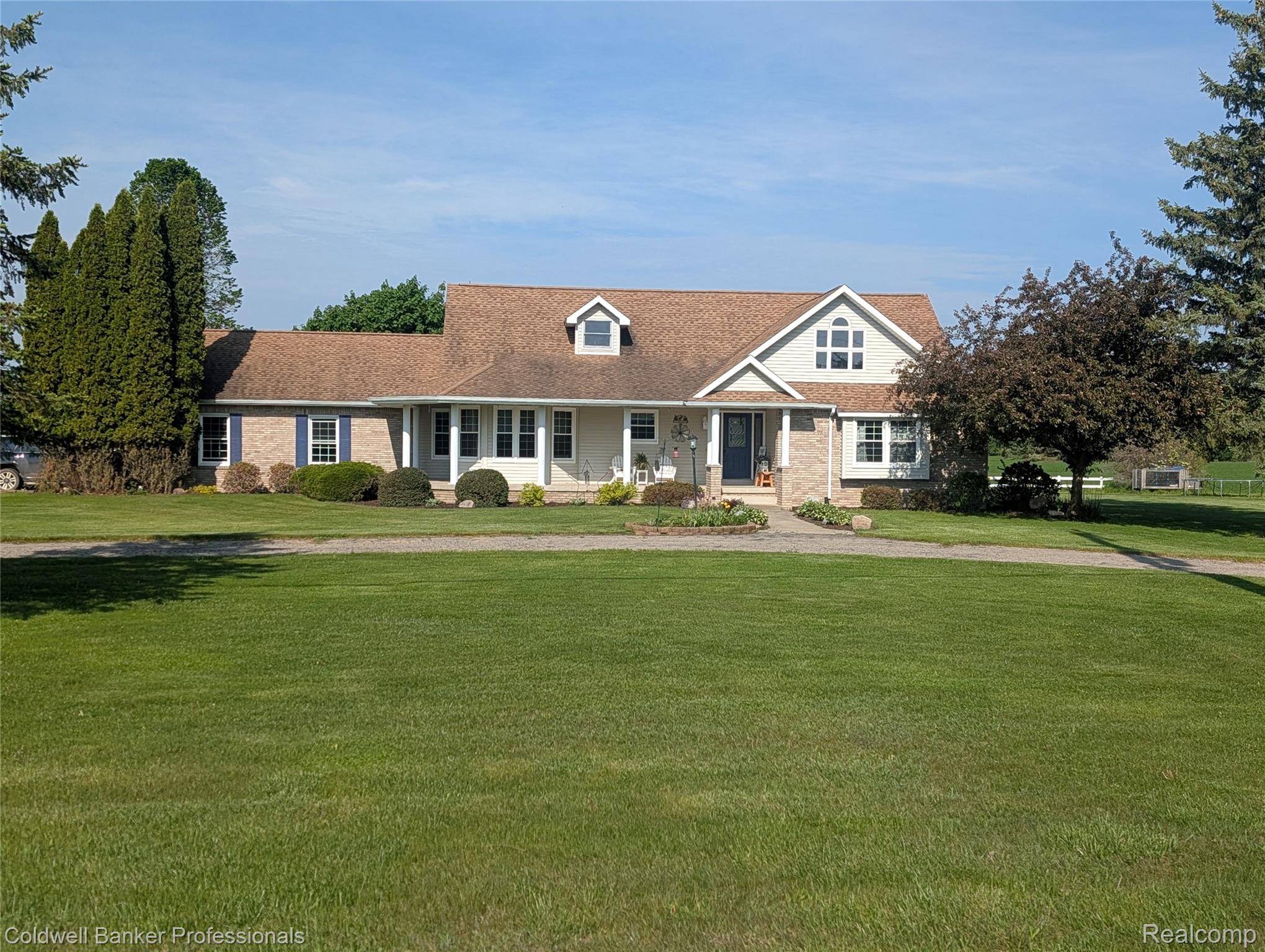 3210 South Kingston Road Kingston, MI 48741 - Photo 1 of 64 View of front of house featuring covered porch, a front lawn, and brick siding