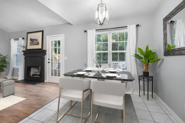 a dining room with furniture a livingroom and chandelier