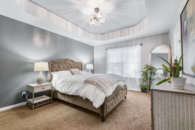 a bedroom with bed and window