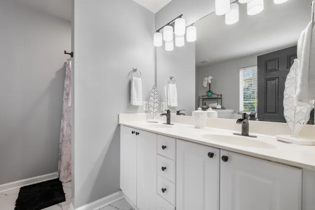 a white bath tub sitting next to a window