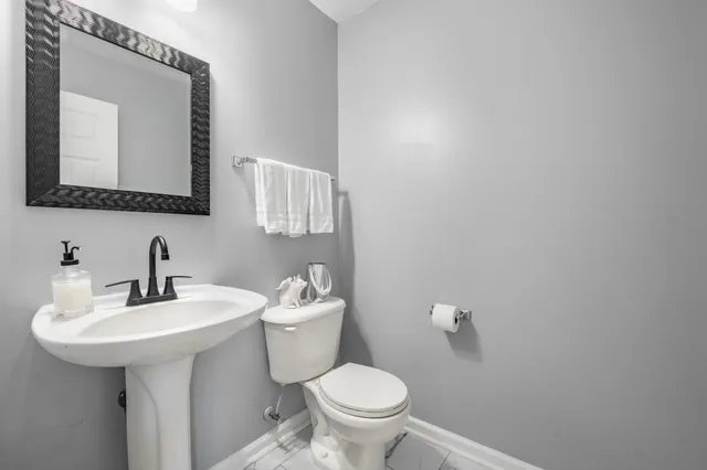a view of a livingroom with furniture and a flat screen tv