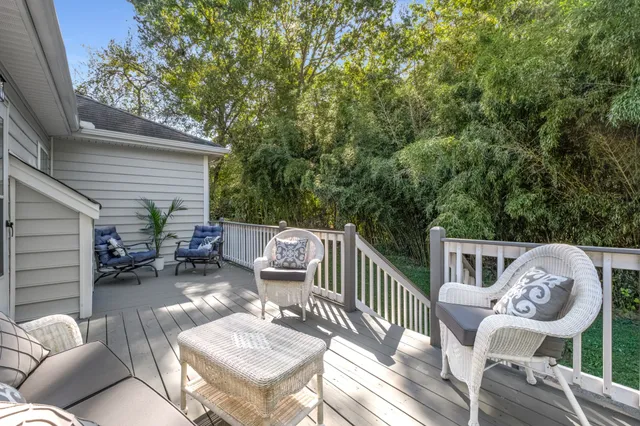 a view of a chair and tables in the balcony