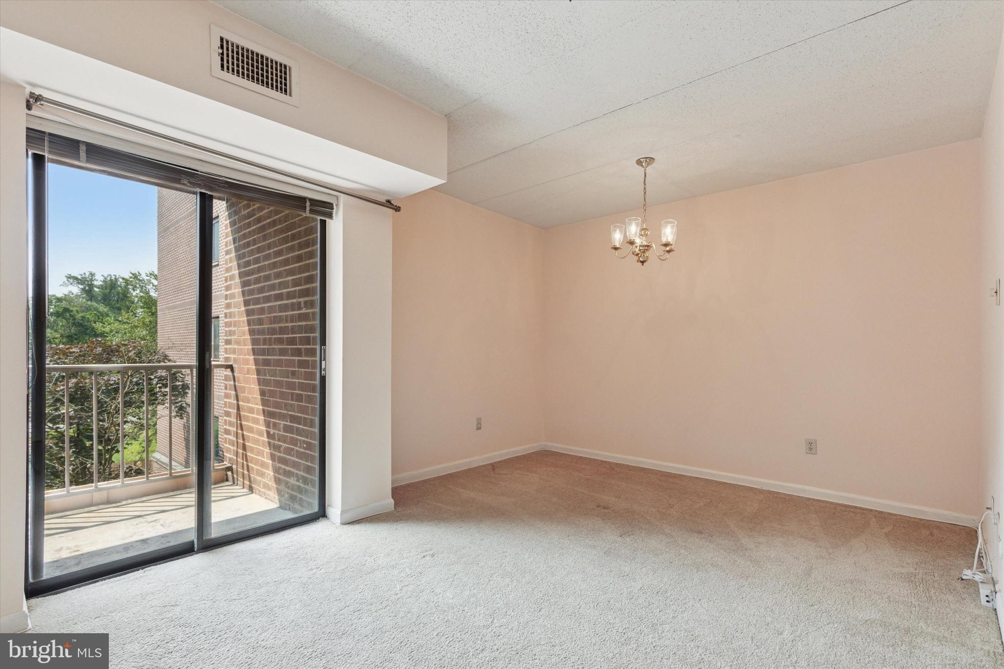 1219 West Wynnewood Road, Unit 400 Wynnewood, PA 19096 - Photo 6 of 15 an empty room with windows