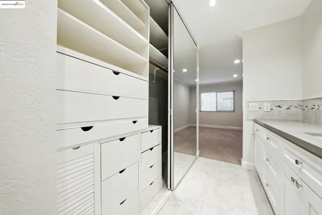 a view of parking garage with lots of wooden furniture