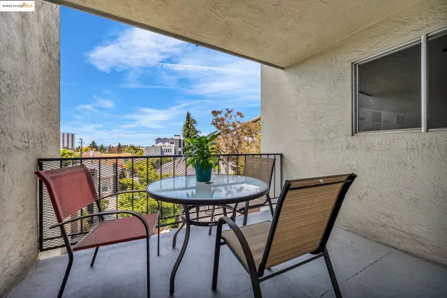 a view of a brick house with many windows