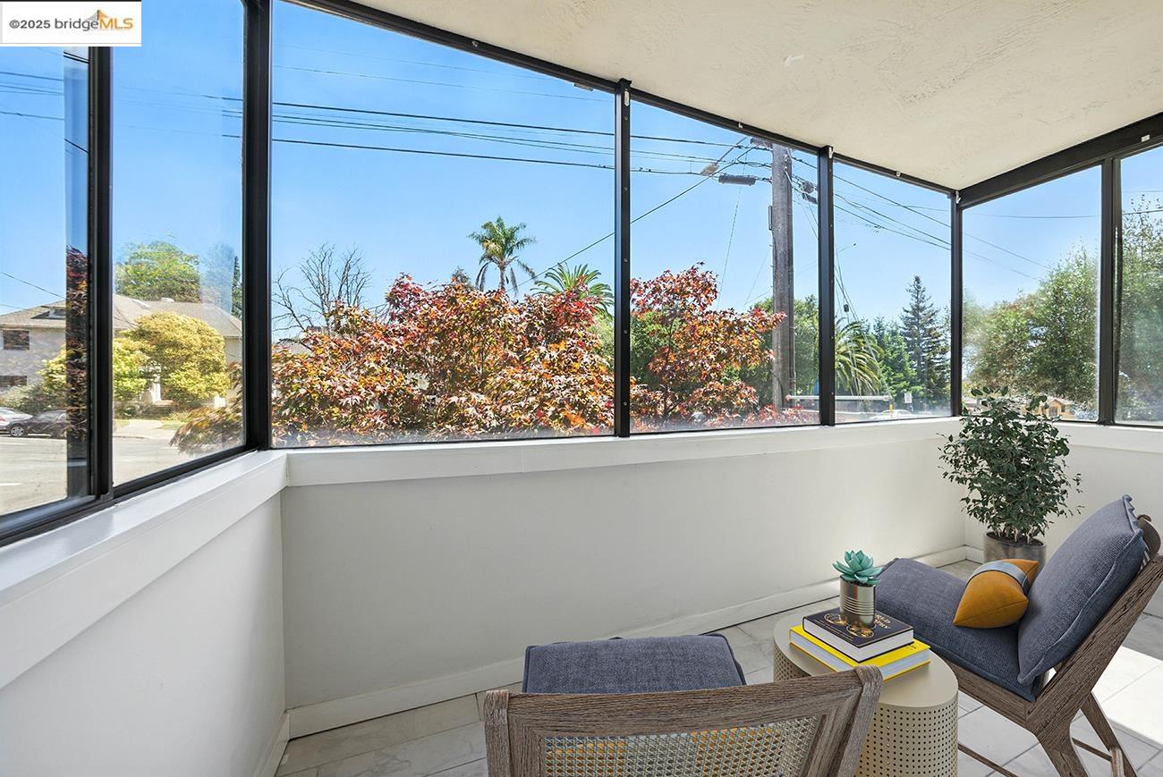 567 Oakland Avenue, Unit 101 Oakland, CA 94611 - Photo 4 of 50 Sunroom / solarium featuring tile patterned floors and baseboards