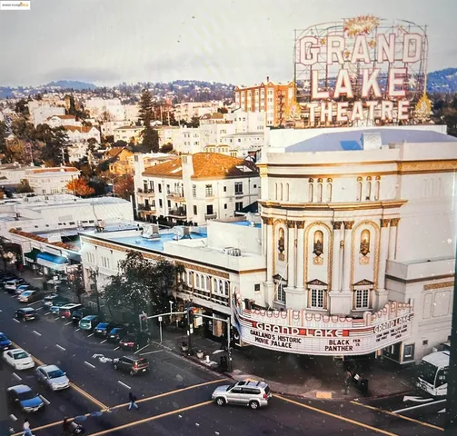 a view of a building with car parked
