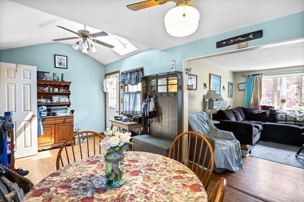 14 Tower Circle Bourne, MA 02532 - Photo 8 of 19 a living room with furniture a rug and a chandelier
