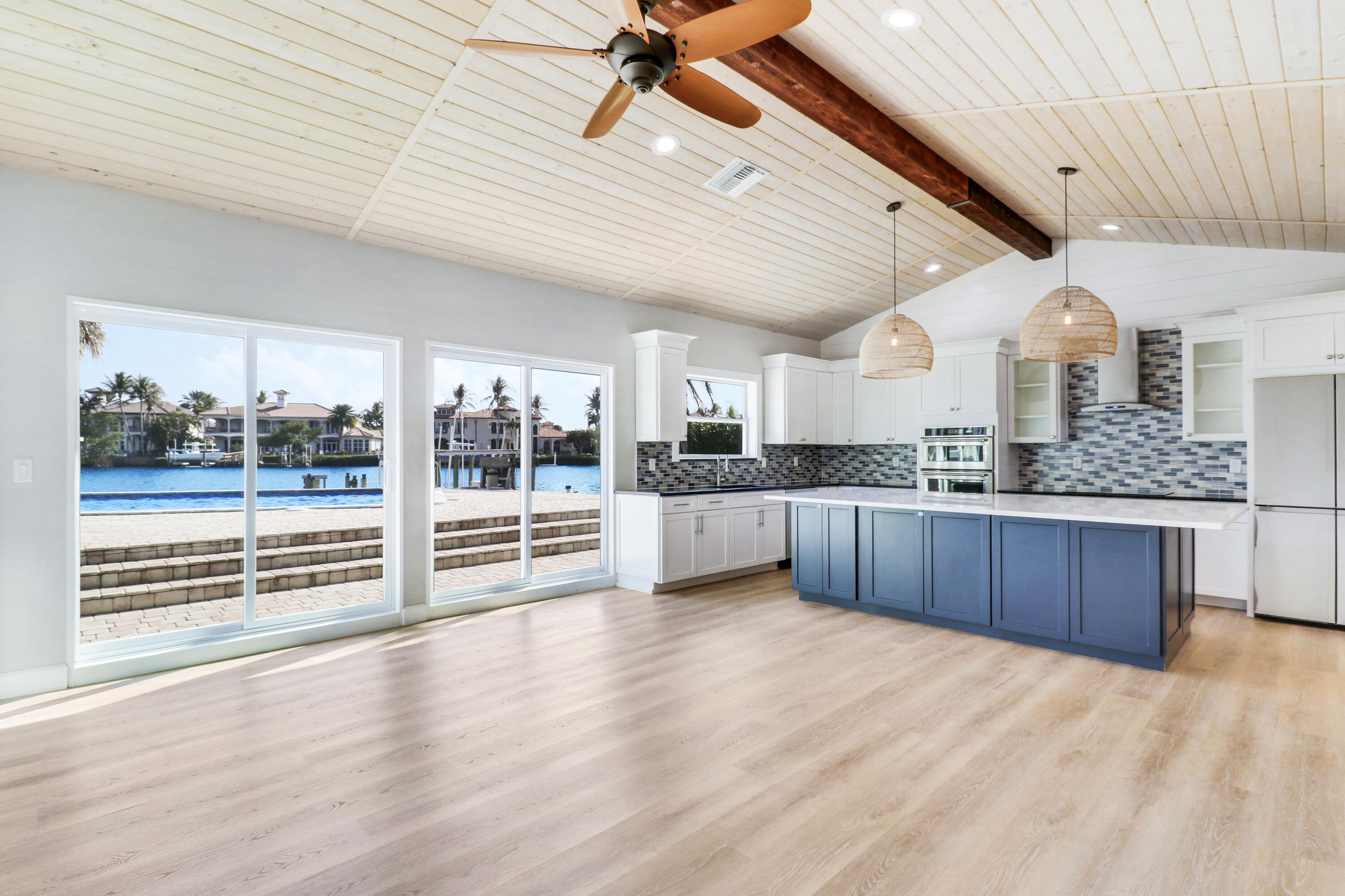 9195 Southeast Cove Point Street Jupiter, FL 33469 - Photo 22 of 80 a view of kitchen with sink and wooden floor