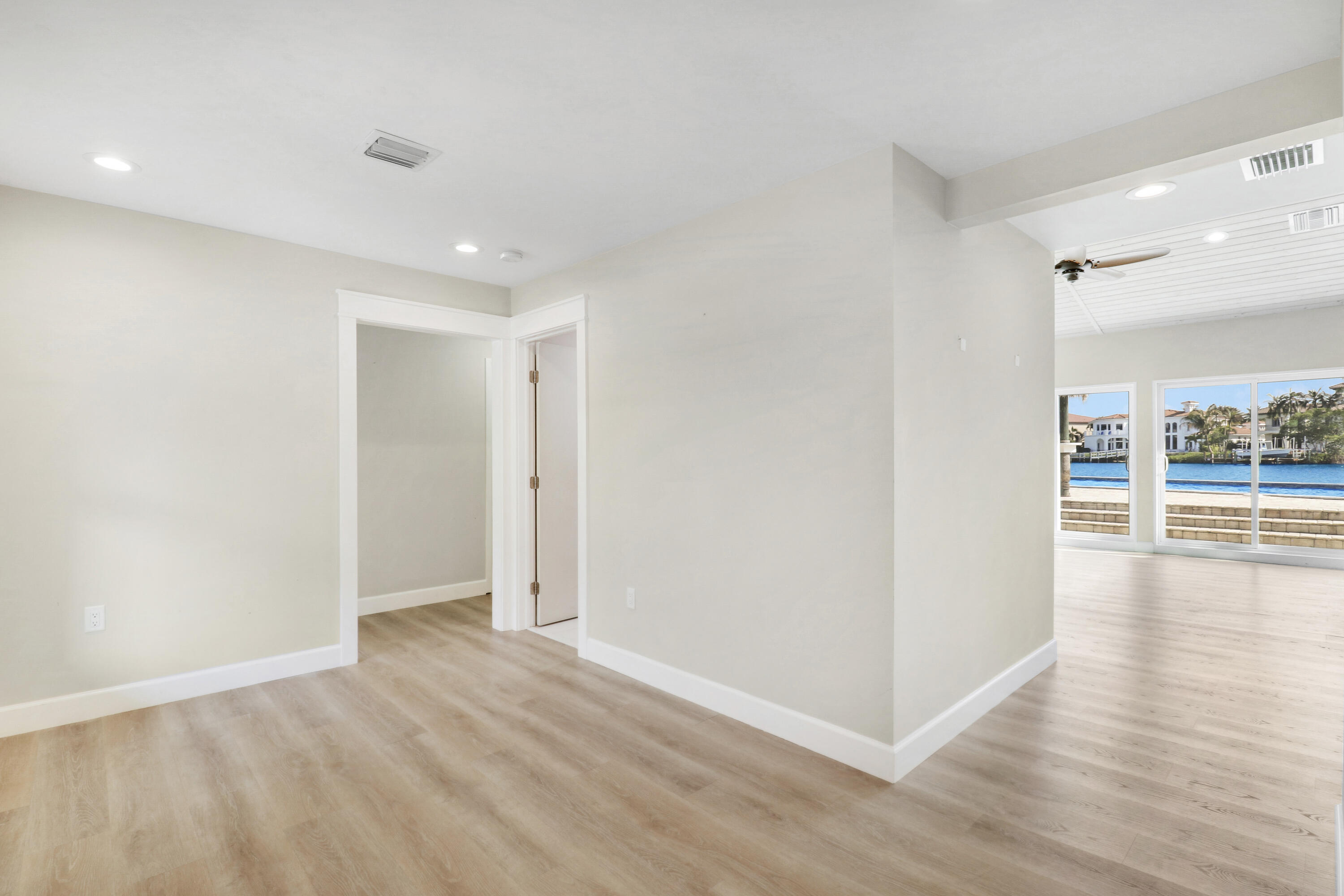 9195 Southeast Cove Point Street Jupiter, FL 33469 - Photo 24 of 80 wooden floor in an empty room with a window