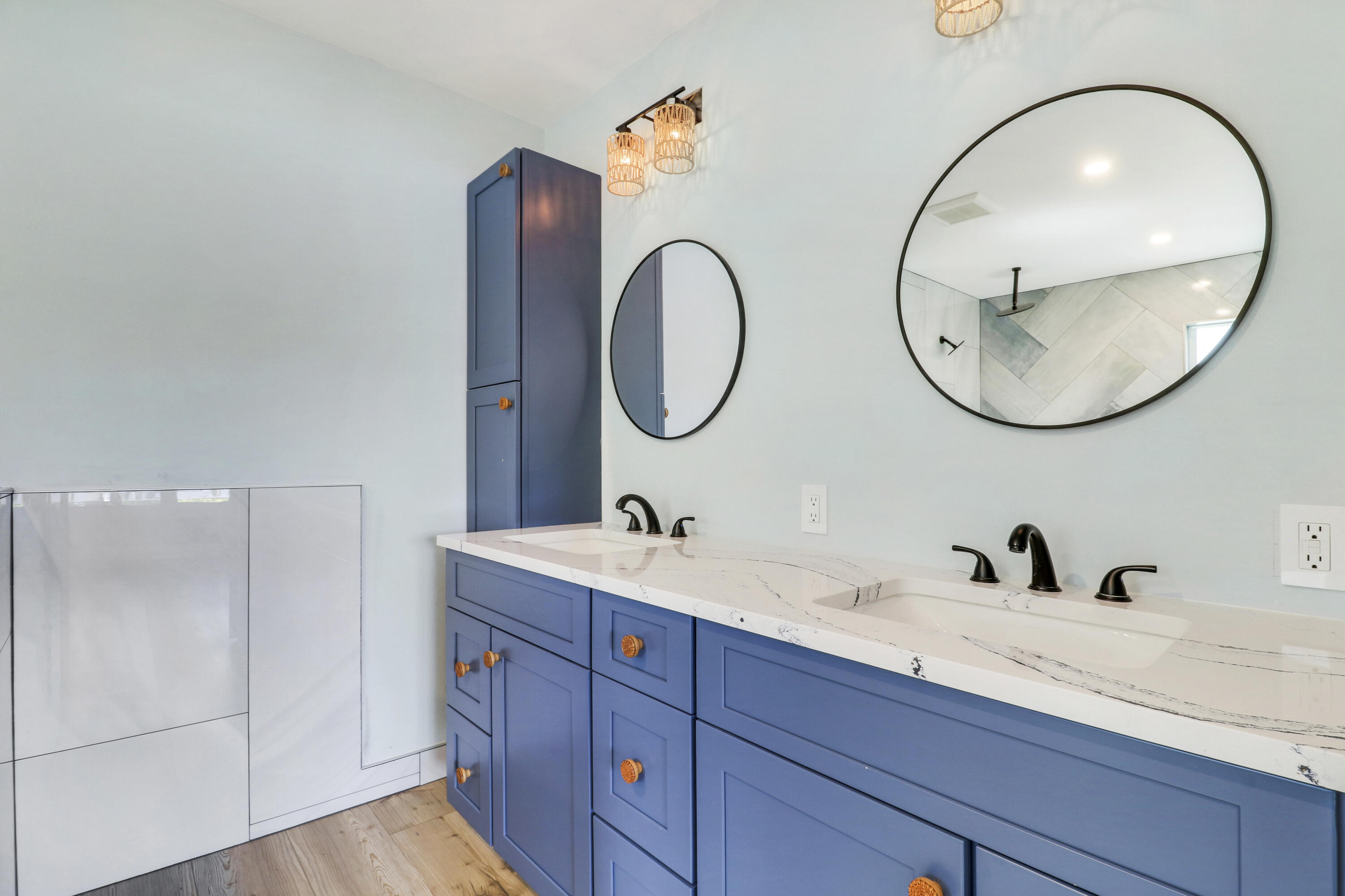 9195 Southeast Cove Point Street Jupiter, FL 33469 - Photo 53 of 80 a bathroom with a sink and a mirror