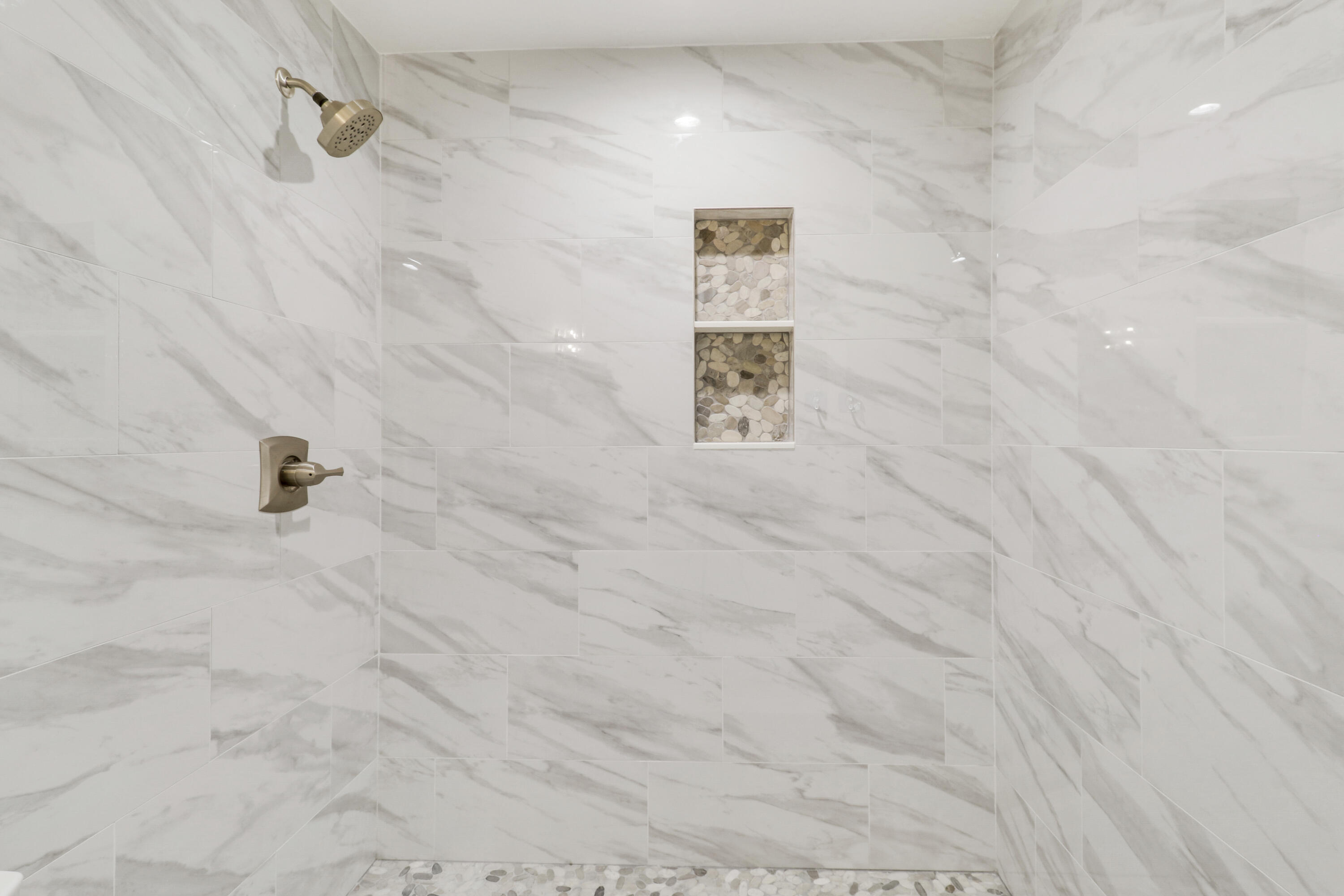 9195 Southeast Cove Point Street Jupiter, FL 33469 - Photo 57 of 80 a bathroom with a shower