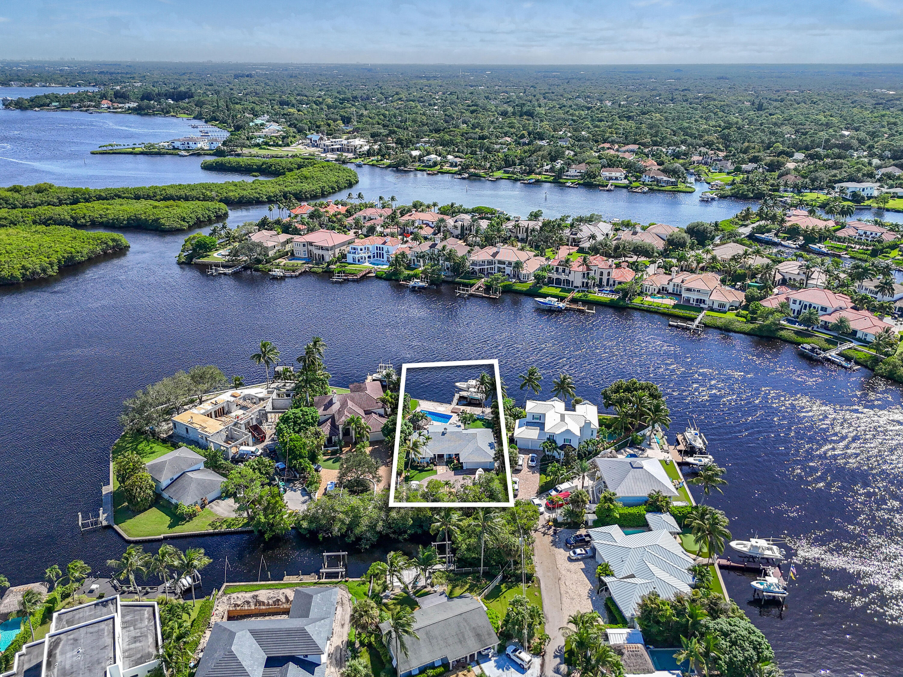 9195 Southeast Cove Point Street Jupiter, FL 33469 - Photo 60 of 80 an aerial view of a house with a lake view