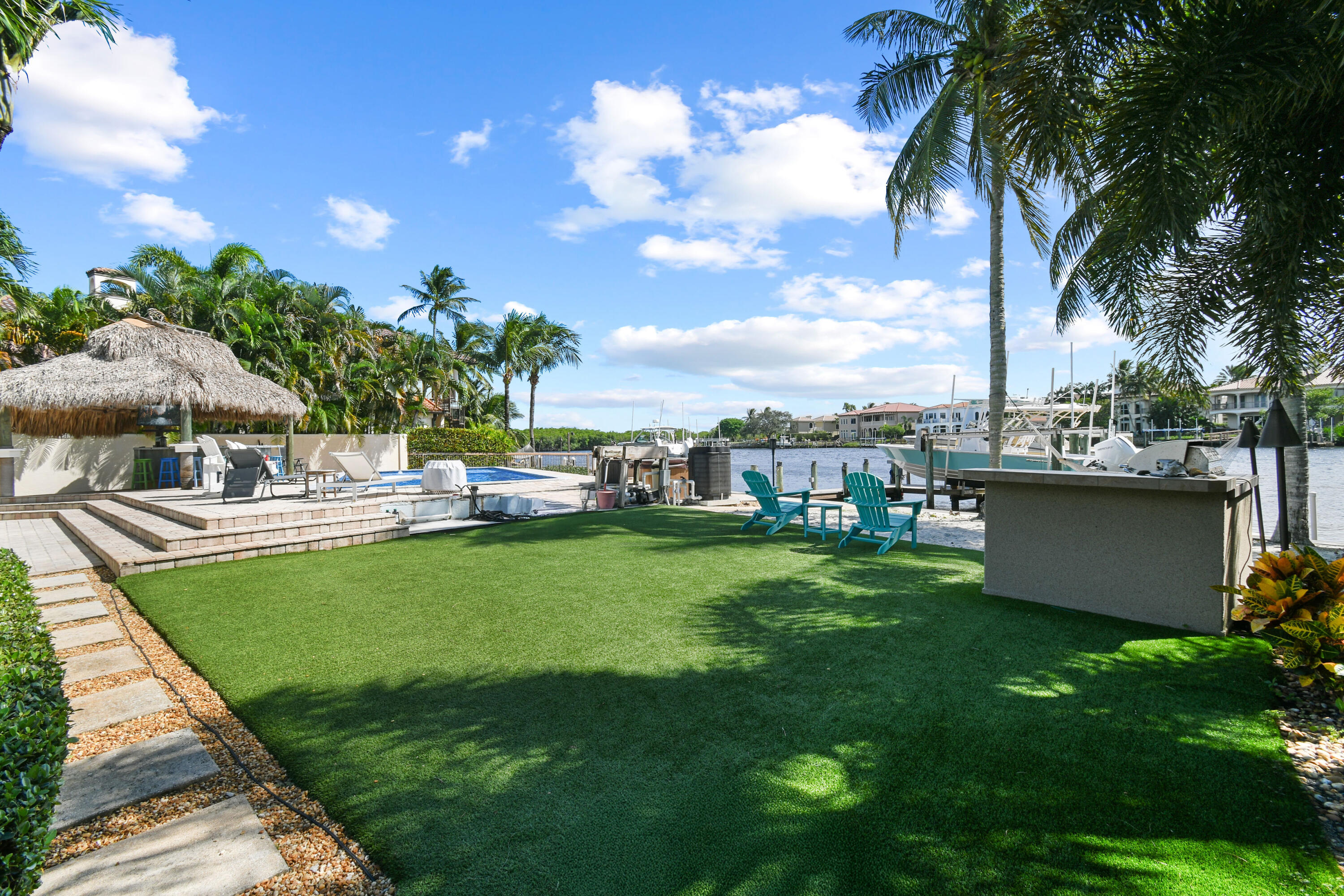 9195 Southeast Cove Point Street Jupiter, FL 33469 - Photo 70 of 80 a view of a garden with a house