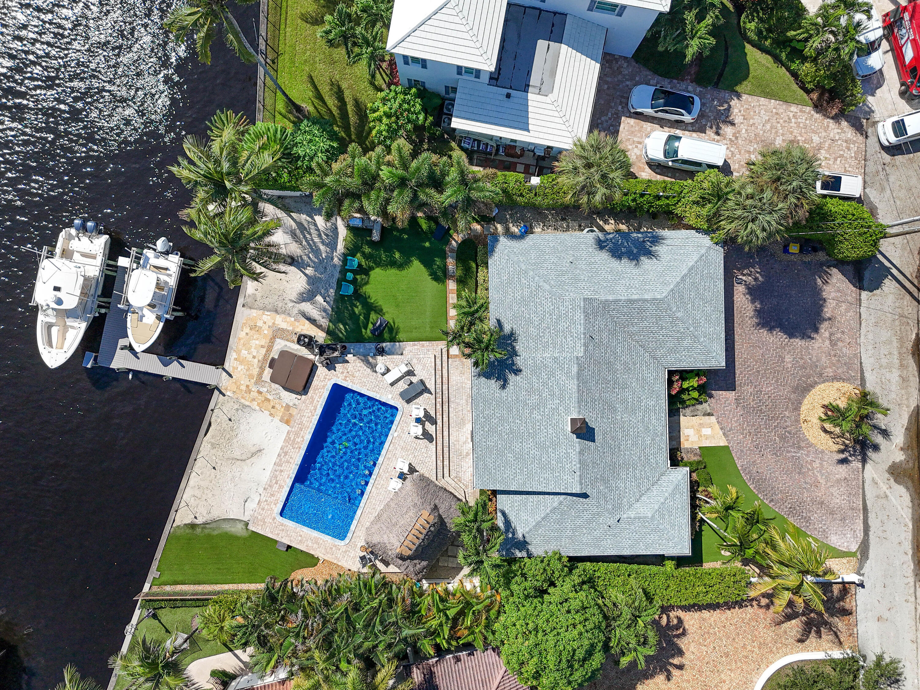 9195 Southeast Cove Point Street Jupiter, FL 33469 - Photo 77 of 80 an aerial view of house with yard swimming pool and outdoor seating