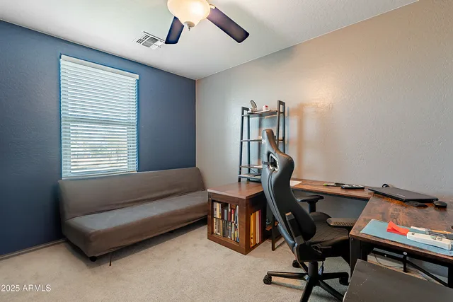 a view of a workspace with furniture