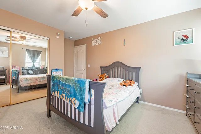 a bathroom with a sink mirror vanity and toilet