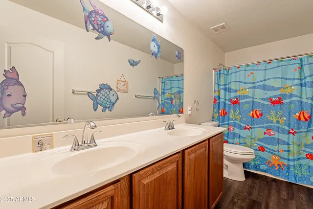 a utility room with dryer and window