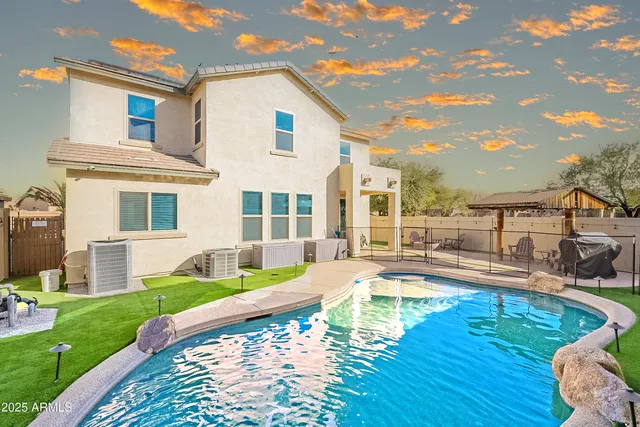 a view of a swimming pool with a lounge chairs