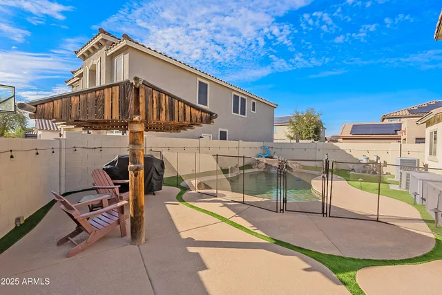 a view of a chairs and table in the patio