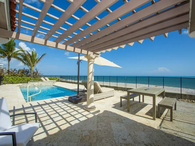 a view of a swimming pool with a patio