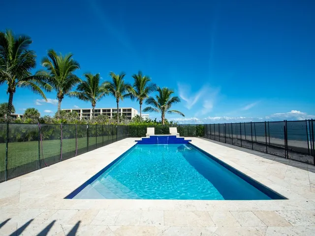 a view of swimming pool with a patio