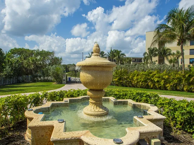 a view of a swimming pool in a backyard