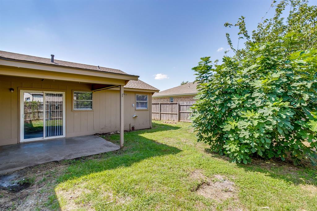 1203 North Nolan River Road, Unit A Cleburne, TX 76033 - Photo 19 of 20 a view of a house with a backyard