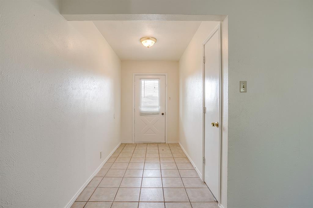 1203 North Nolan River Road, Unit A Cleburne, TX 76033 - Photo 4 of 20 a view of an empty room