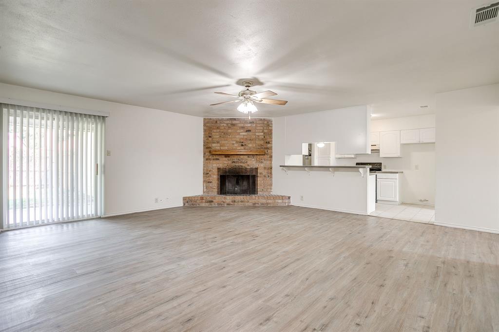 1203 North Nolan River Road, Unit A Cleburne, TX 76033 - Photo 10 of 20 a view of a kitchen with a sink and a fireplace