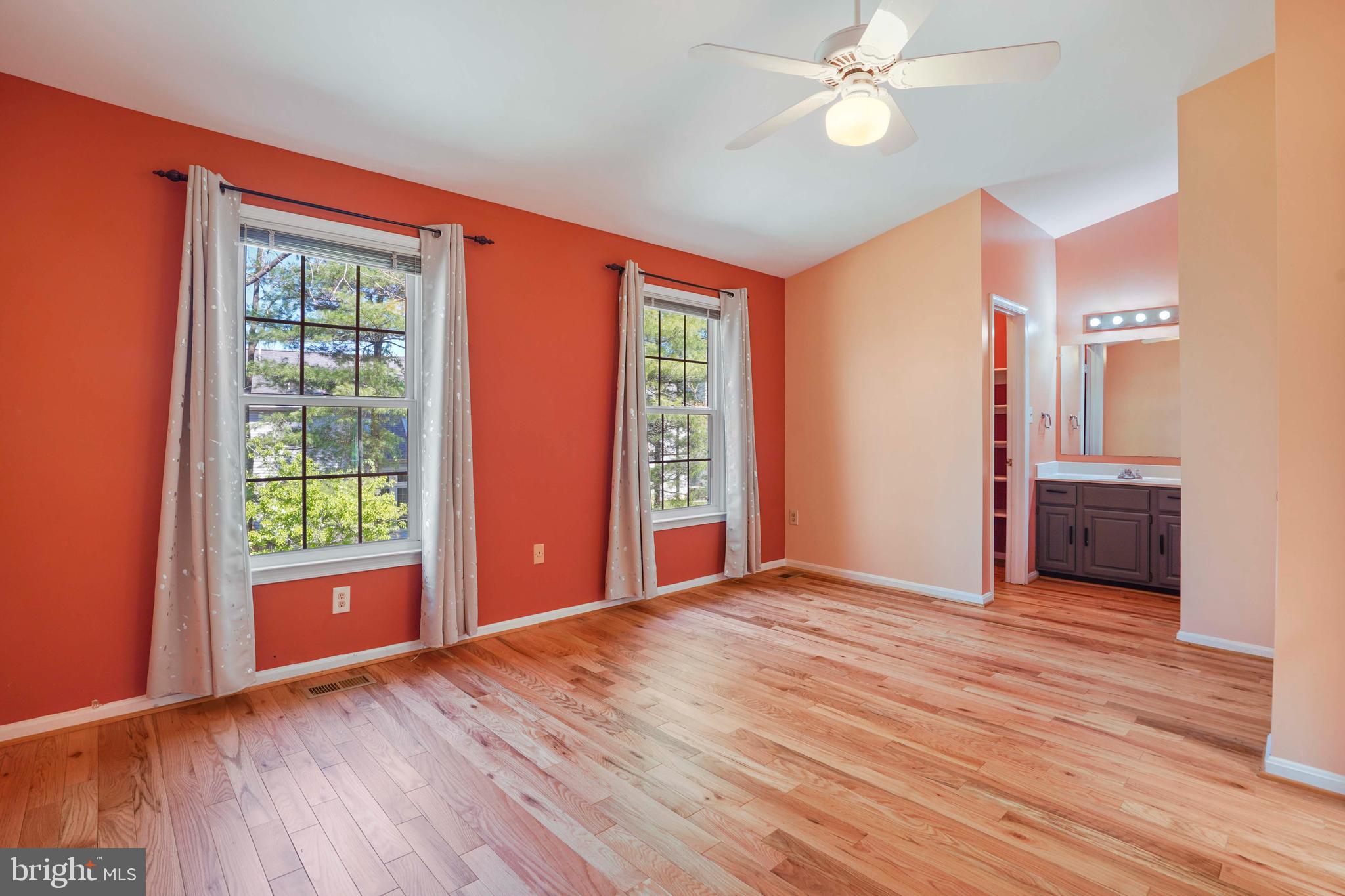 11322 Baritone Court Silver Spring, MD 20901 - Photo 11 of 29 a view of empty room with wooden floor and fan