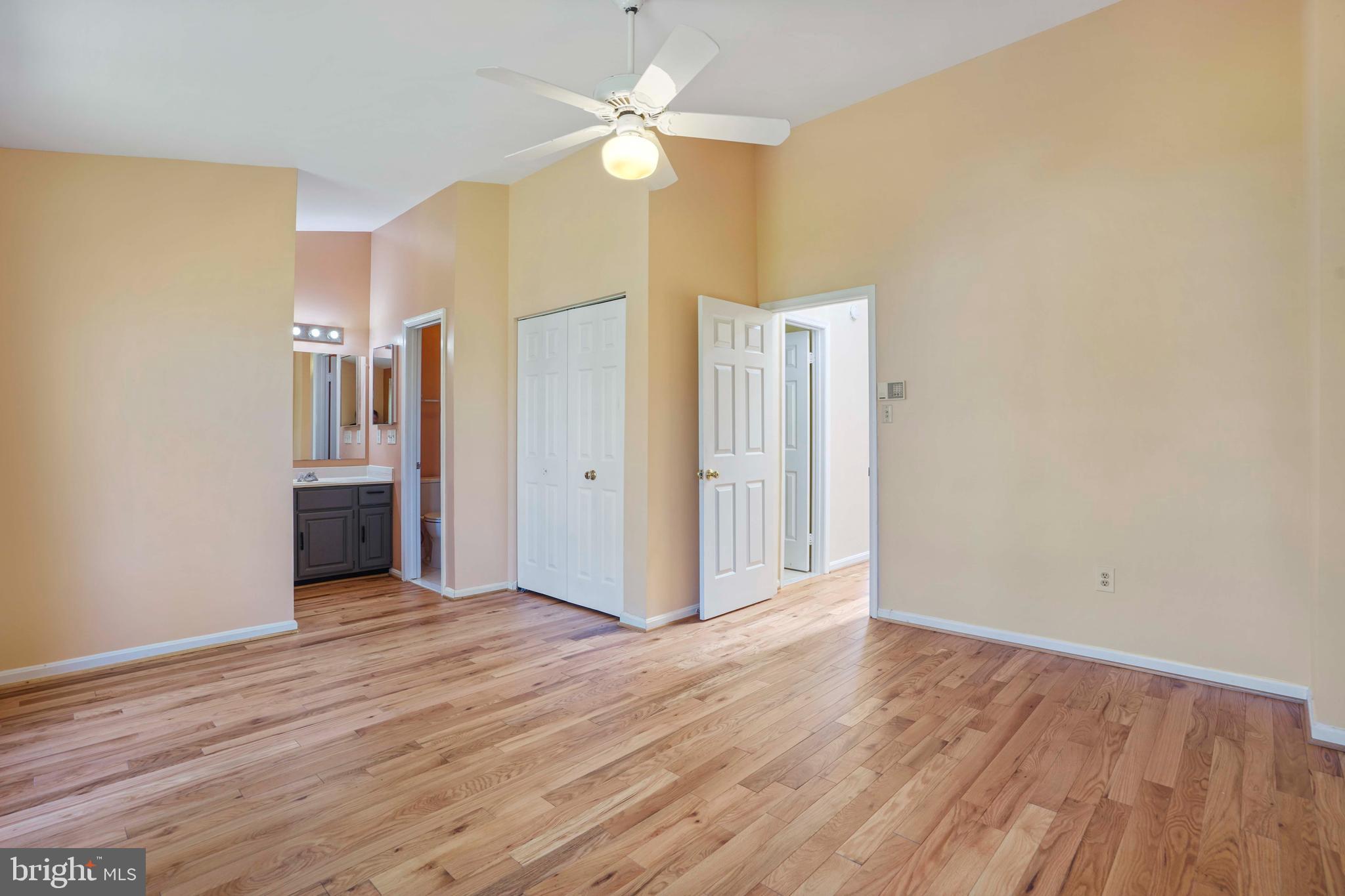 11322 Baritone Court Silver Spring, MD 20901 - Photo 12 of 29 wooden floor in an empty room with a window