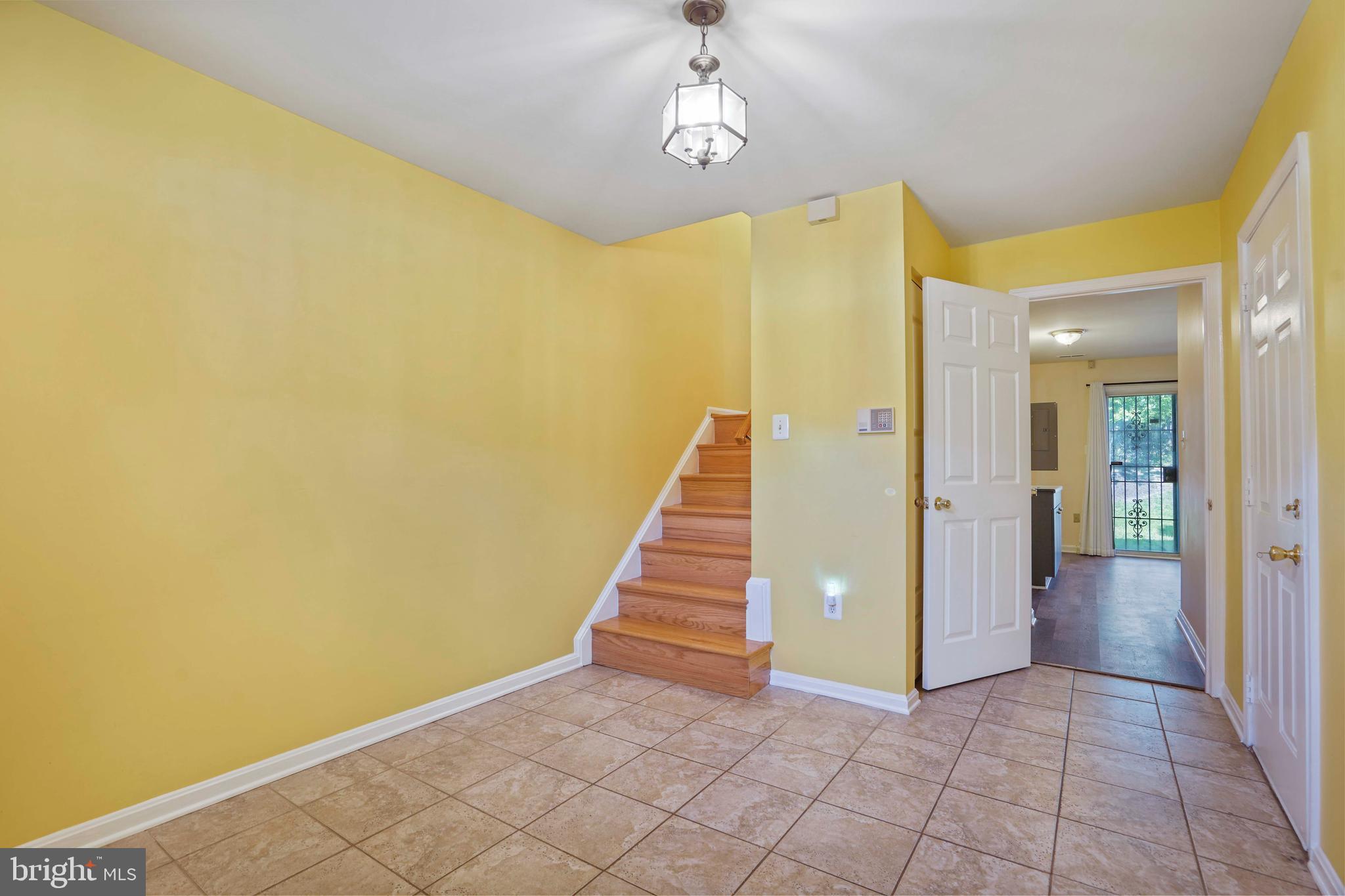 11322 Baritone Court Silver Spring, MD 20901 - Photo 21 of 29 a view of a hallway with wooden floor and staircase