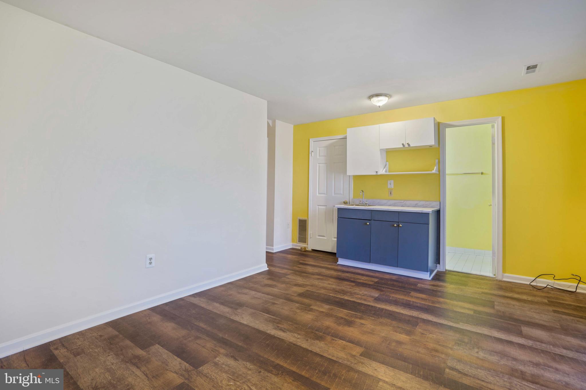 11322 Baritone Court Silver Spring, MD 20901 - Photo 24 of 29 a view of a room with wooden floor